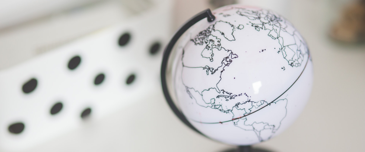 Photograph of black and white globe on desk