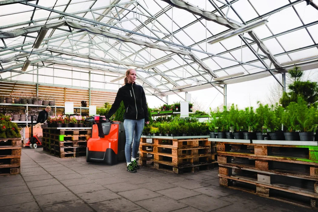 BT Levio LWE powered pallet truck, electric walkie low-lifter. Application photo in a green house. 