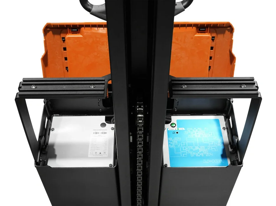 BT Staxio SWE080L electric walkie stacker with elevating support arms. Details photo of battery compartment.