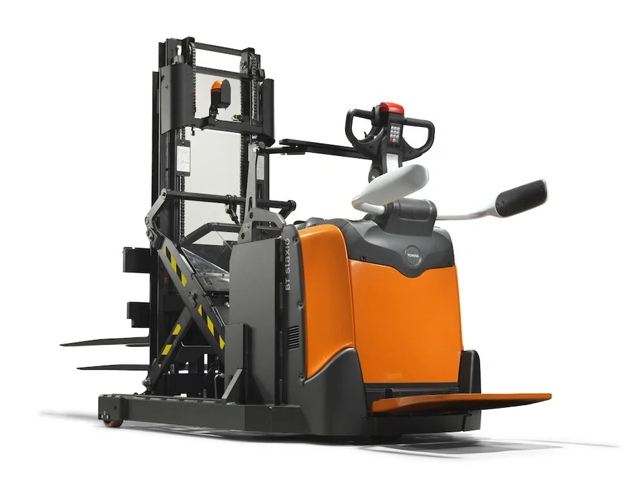 BT Staxio SPE120XRD, electric stacker with reach mast, double load handling, platform, and side guards. Product photo taken from the back at an angle.