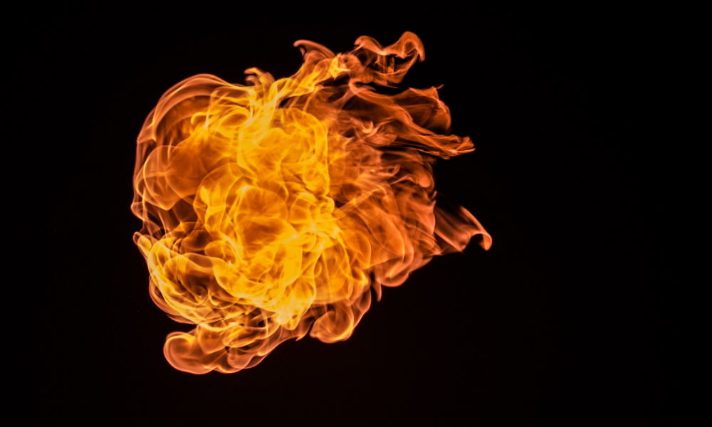 Flame against black background