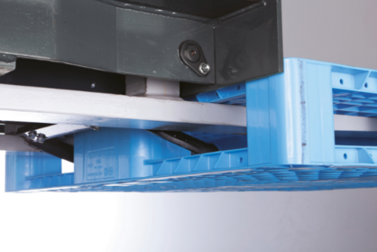 Close-up of fork clamps holding a pallet.